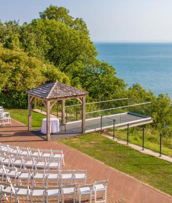 The outdoor seating, wedding gazebo and platform at The Venue, Sandy Cove Hotel