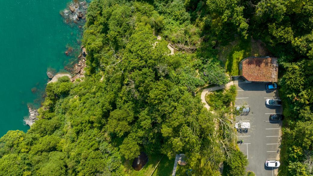 An aerial view over the ceremony room and guest parking at The Venue, Sandy Cove Hotel