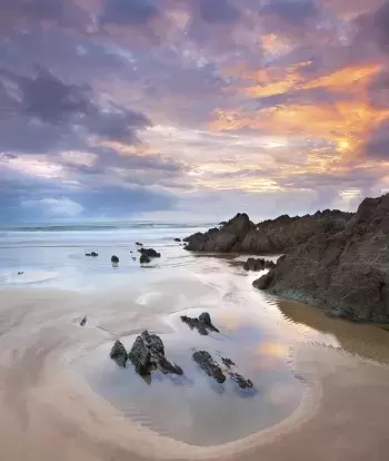 Rock pools at sunset on Croyde Beach in North Devon