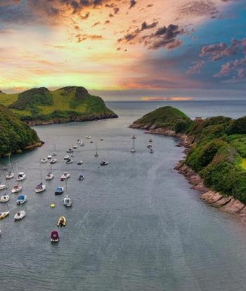 Sunset over the boats at Watermouth on the North Devon coast