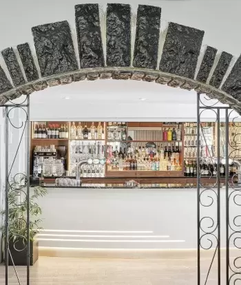 The bar at Sandy Cove Hotel seen through an arch