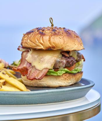 A burger with fries served at Sandy Cove Hotel