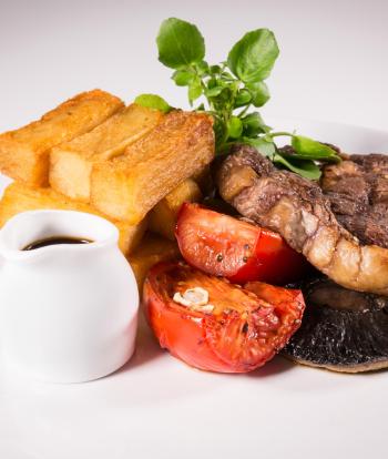 A close up of a steak meal in one of Sandy Cove Hotel's restaurants