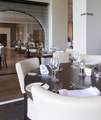 Tables inside the Cove Restaurant at the Sandy Cove Hotel