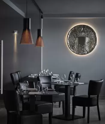 Tables and decor inside the Seacliff Restaurant at Sandy Cove Hotel