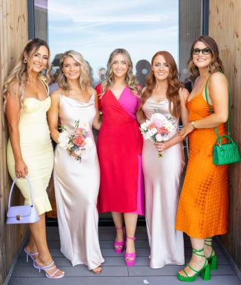 Guests and bridesmaids outside The Venue at Sandy Cove