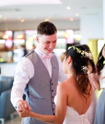 A bride and groom sharing their first dance on their wedding day at The Venue, Sandy Cove Hotel