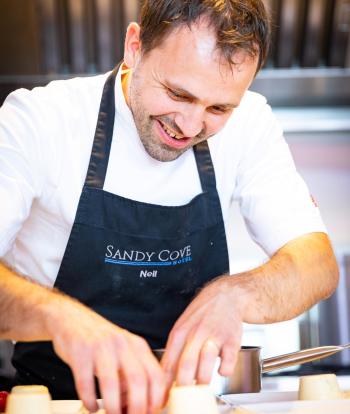 A chef preparing food for a wedding at The Venue, Sandy Cove