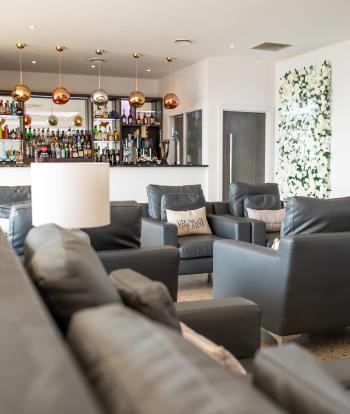 Armchairs in the bar area of The Venue at Sandy Cove Hotel