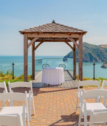 The wedding Gazebo outside the Venue at Sandy Cove Hotel with a view over the bay behind