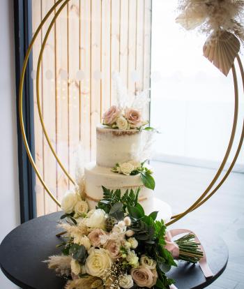 A wedding cake with winter decorations at The Venue, Sandy Cove Hotel