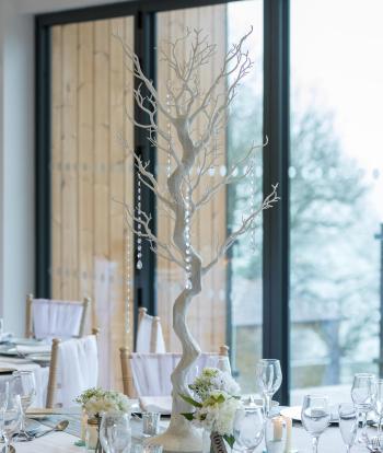 A table centrepiece at a winter wedding at The Venue, Sandy Cove