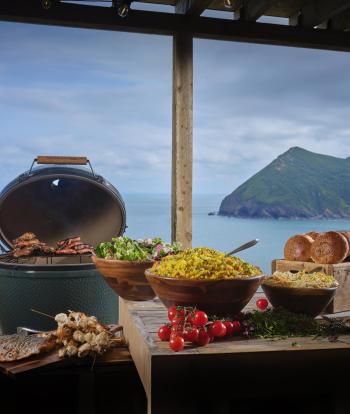 Inside The Venue at Sandy Cove with buffet on table in front of sea view