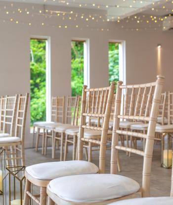 Chairs for wedding guests inside the Ceremony Room at Sandy Cove Hotel