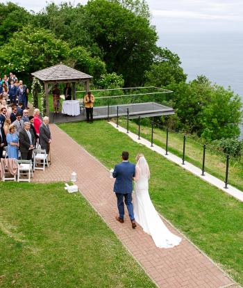 Bride walking down to the ceremony area