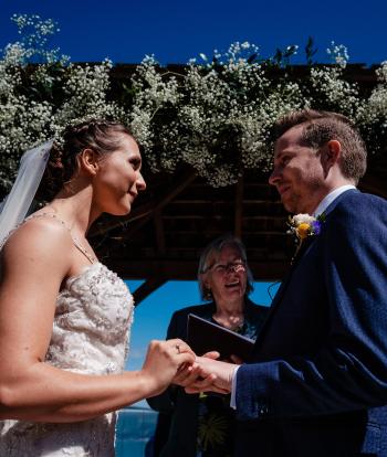 Bride and groom standing outside 