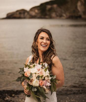 Bride on the beach at the Sandy Cove Hotel, Devon