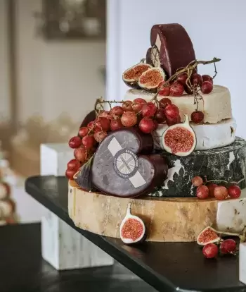 A selection of cheese on a table for a wedding reception at The Venue, Sandy Cove Hotel