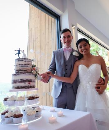 Bride and groom cutting the wedding cake