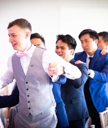 wedding guests looking happy dancing at the sandy cove hotel