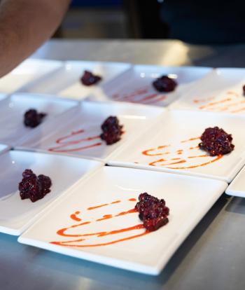 Chef preparing food for a wedding at the Sandy Cove Hotel, Devon