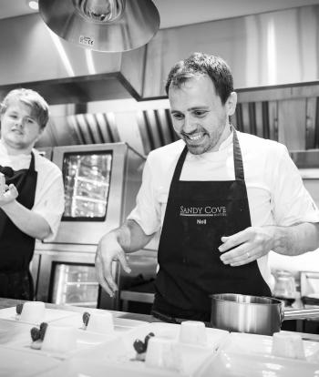 Chef preparing food for a wedding at the Sandy Cove Hotel, Devon