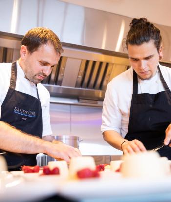 Chef preparing food for a wedding at the Sandy Cove Hotel, Devon