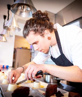 Chef preparing food for a wedding at the Sandy Cove Hotel, Devon