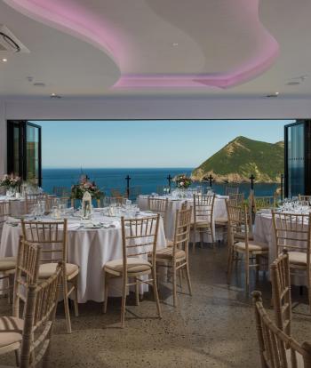 Wedding tables set up for guests with view behind