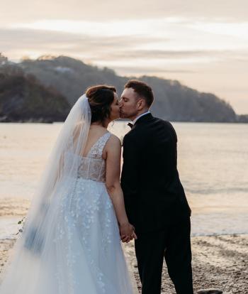 Wedding couple on the beach at sunset