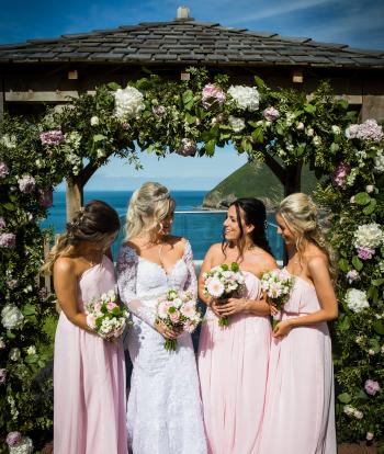 Bride & Bridesmaids outside under gazebo