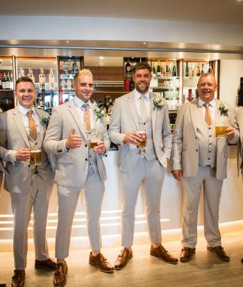 Groom & Groomsmen in Bar before wedding