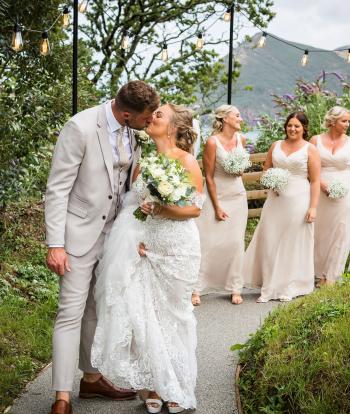 Bride & Groom on path after ceremony 