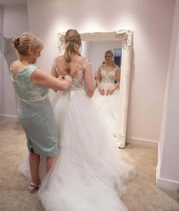Bride Getting Ready in Wedding Prep Suite