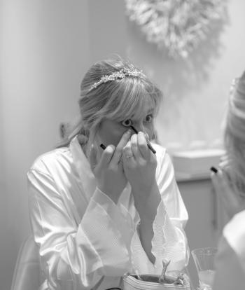 Bride Getting Ready in Wedding Prep Suite