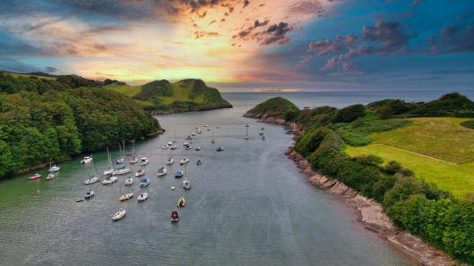 Sunset over the boats at Watermouth on the North Devon coast