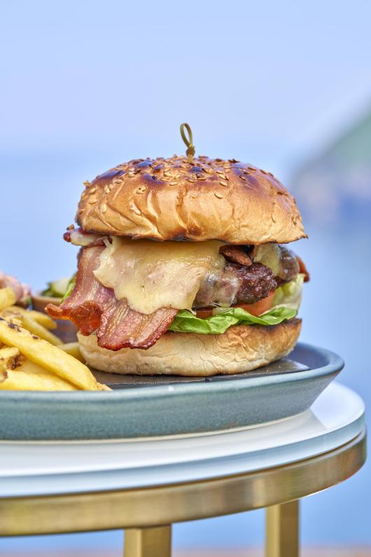 A burger with fries served at Sandy Cove Hotel