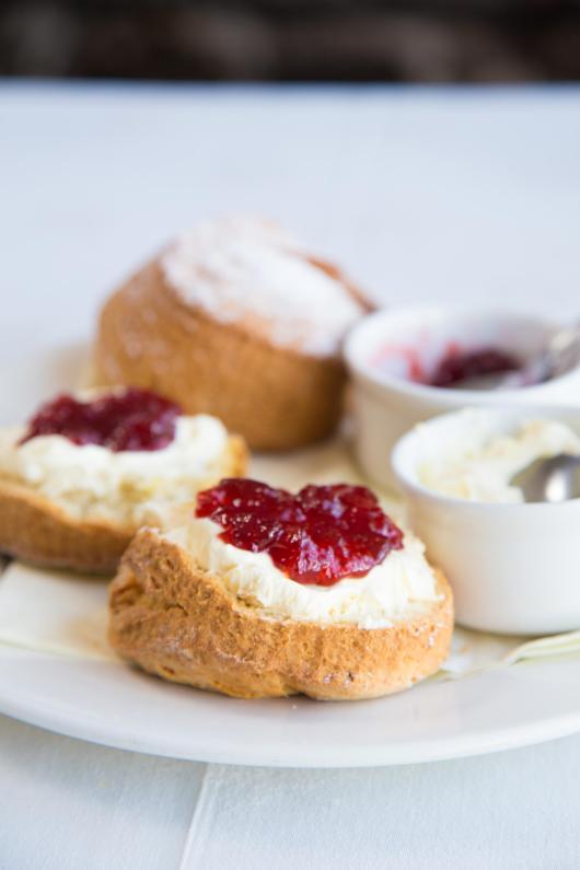 A plate of scones with jam and cream served at the Sandy Cove Hotel