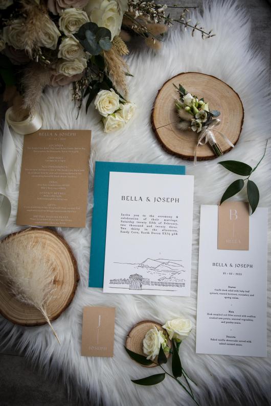 Invitations and decorations for a winter wedding at The Venue, Sandy Cove Hotel