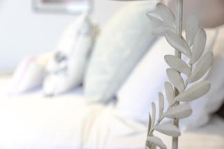 A closeup of the bedside lamp inside a Superior Sea View with Balcony room at Sandy Cove Hotel